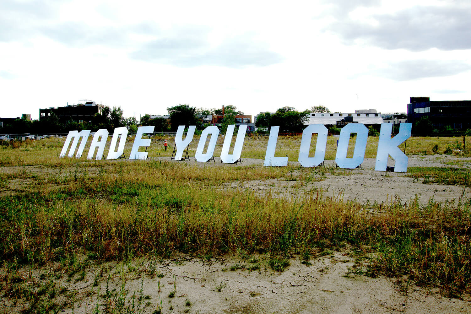 7FT silver letters that read Made you look behind the Museum of Contemporary Arts
